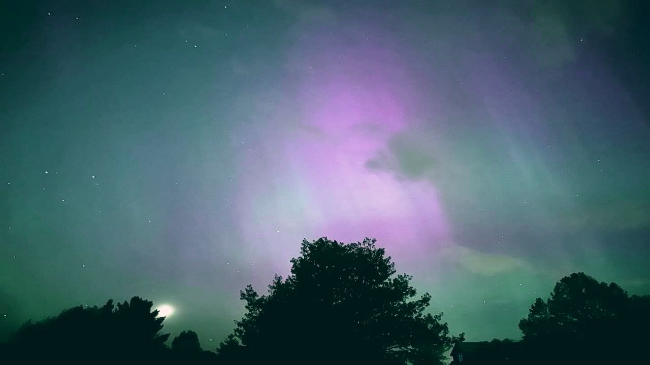 Woman holding a bright white light
